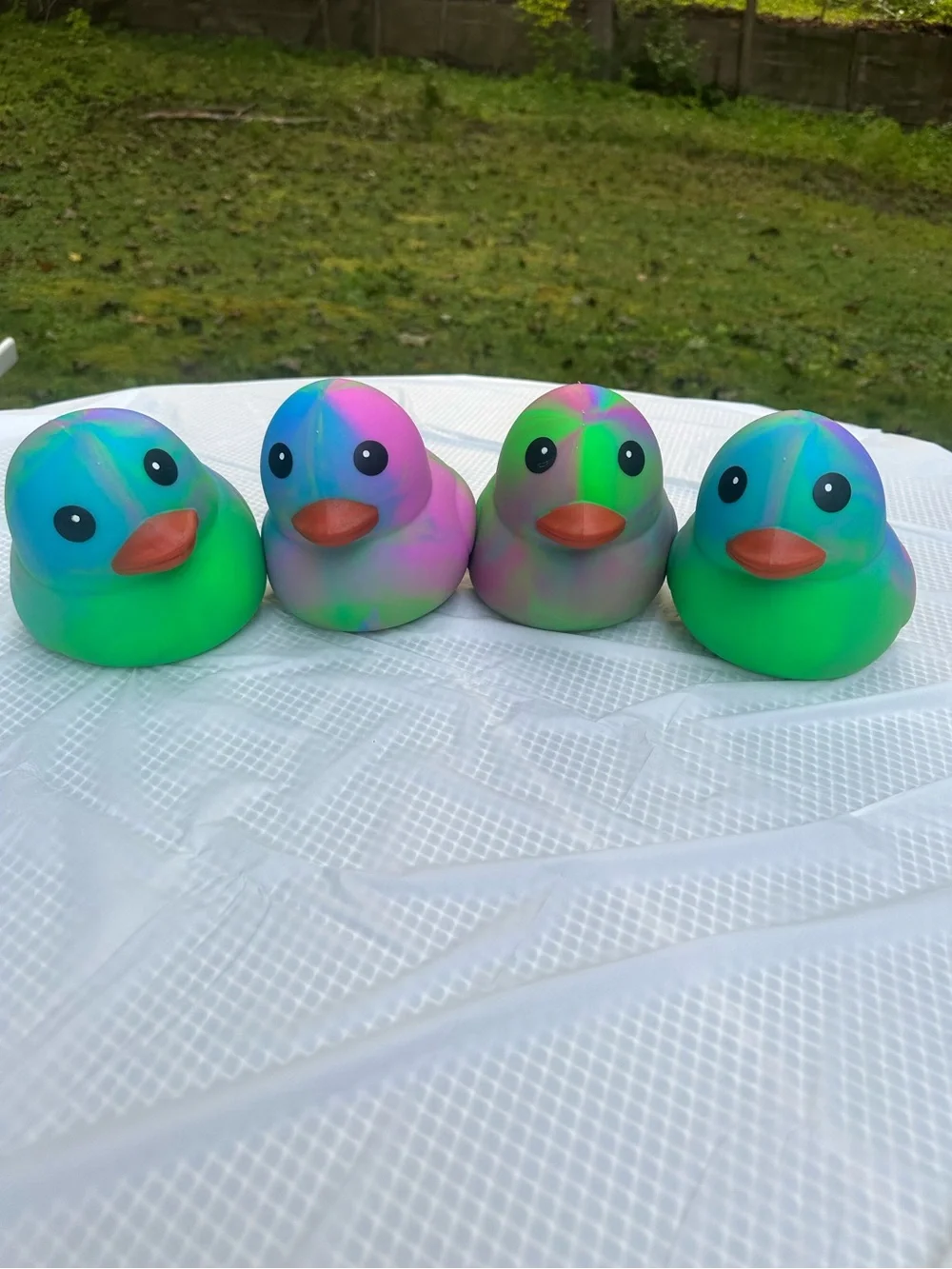 ONE Sunny Days Squeeezy tiedye duck jumbo squishy squeezy fidget toy multicolor